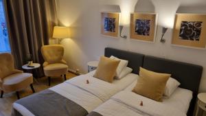Postel nebo postele na pokoji v ubytování Hotell Västerås