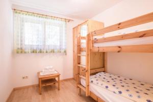 A bed or beds in a room at Lettnerhof Bnb Wohnung 3