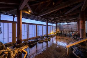 a large room with water inside of it at Ikkyu -Seaside Hotel- in Tsuruoka