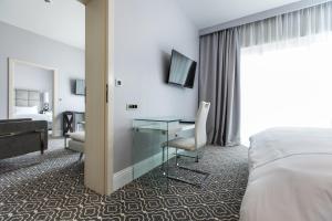 Ein Bett oder Betten in einem Zimmer der Unterkunft Royal Palm Hotel