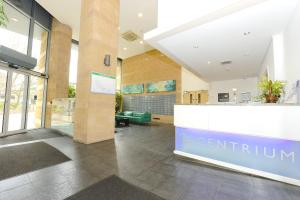 a lobby of a building with a reception counter at Woking Town Centre - Parking Included by Deilamy Homes in Woking