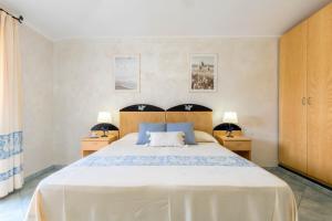 Postel nebo postele na pokoji v ubytování Hotel Villa del Mare Solanas