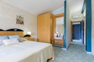 Postel nebo postele na pokoji v ubytování Hotel Villa del Mare Solanas
