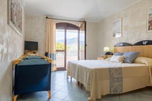 Postel nebo postele na pokoji v ubytování Hotel Villa del Mare Solanas