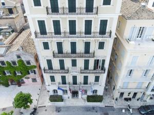 an overhead view of a large white building with a balcony at Cavalieri Hotel in Corfu Town