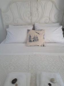 A bed or beds in a room at STATHIS GUESTHOUSE