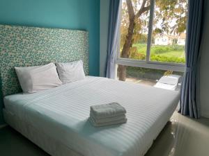 Postel nebo postele na pokoji v ubytování Atlantis Condo Resort jomtien