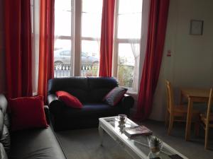 a living room filled with furniture and a window at The Weston Super Mare Guest House in Weston-super-Mare