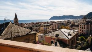 a view of a city with the ocean and buildings at Virgilio 2 - Villa Bice in Alassio