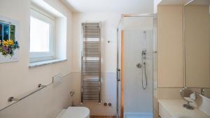 a bathroom with a toilet and a shower at Virgilio 2 - Villa Bice in Alassio +69 photos