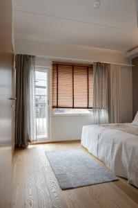 Un pat sau paturi într-o cameră la Tahko SPA Luxury Suite Orange B5 with Mountain View