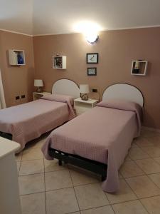 A bed or beds in a room at casa vacanza Le 2 Isole