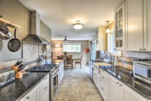 a kitchen with white cabinets and a stove top oven at Family-Friendly Home with Back Yard and Game Room! in Boulder