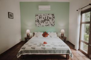 Postel nebo postele na pokoji v ubytování Villa Akasa