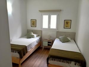 Postel nebo postele na pokoji v ubytování Villa Gallotia