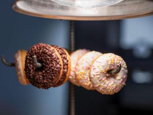 a group of donuts hanging on a rack at Almar Timi Ama Resort & Spa in Villasimius
