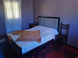 Letto o letti in una camera di Gite Dar Tanzoughte