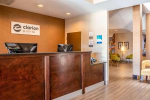 a hotel lobby with a cash counter and a waiting room at Clarion Pointe Harrisonburg in Harrisonburg