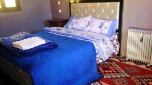 Letto o letti in una camera di Gite Dar Tanzoughte