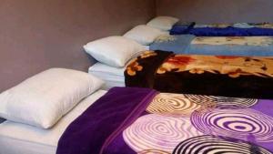 Letto o letti in una camera di Gite Dar Tanzoughte