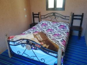 Letto o letti in una camera di Gite Dar Tanzoughte