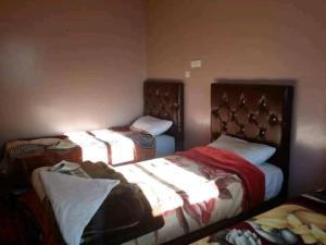 Letto o letti in una camera di Gite Dar Tanzoughte