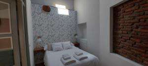 Postel nebo postele na pokoji v ubytování LA CASITA