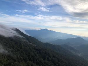 a view of a mountain range with fog in the valley at TopSuites at Ion-Delemen Genting Highlands in Genting Highlands