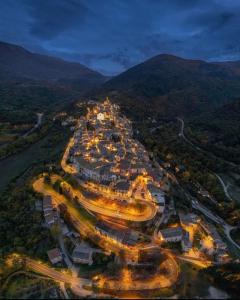 an aerial view of a city at night at Casa Ai Piedi Della Riserva Naturale in Pettorano sul Gizio