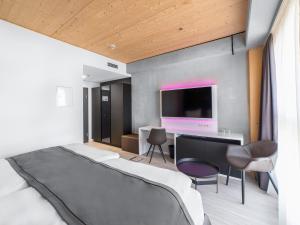 Ein Bett oder Betten in einem Zimmer der Unterkunft DORMERO HoHo Wien