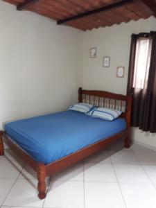 Giường trong phòng chung tại Kitnet Central - Arraial do Cabo