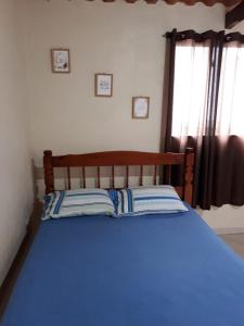 Giường trong phòng chung tại Kitnet Central - Arraial do Cabo