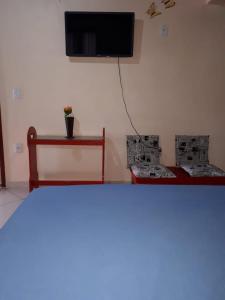 TV/trung tâm giải trí tại Kitnet Central - Arraial do Cabo