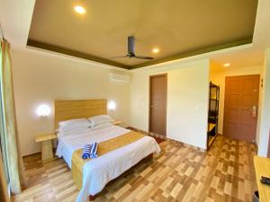 Łóżko lub łóżka w pokoju w obiekcie Paguro Seaview