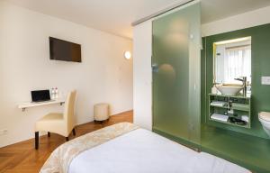 Ένα ή περισσότερα κρεβάτια σε δωμάτιο στο Hotel Oltnerhof - Self Check in