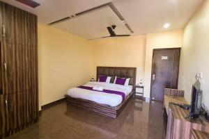 Letto o letti in una camera di JK Hotel Dharamshala