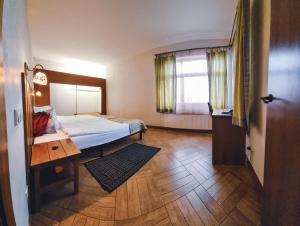 Postel nebo postele na pokoji v ubytování Kapteinu Osta