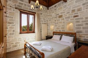 A bed or beds in a room at Kalimera villas