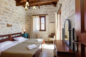 A bed or beds in a room at Kalimera villas