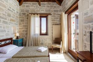 A bed or beds in a room at Kalimera villas