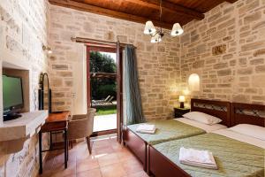 A bed or beds in a room at Kalimera villas Még 37 kép