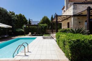 The swimming pool at or close to Kalimera villas