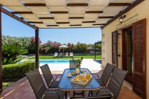 The swimming pool at or close to Kalimera villas