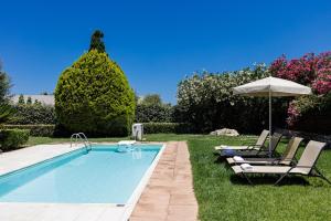 The swimming pool at or close to Kalimera villas