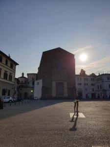 a person standing on a square in front of a building at CA del CARMINE in Florence