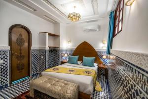 Postel nebo postele na pokoji v ubytování Riad Dilar Fes & Spa + 37 fotografií