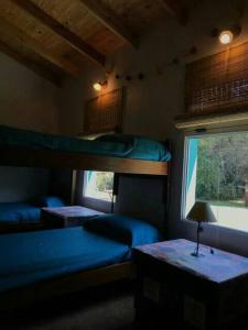 Postel nebo postele na pokoji v ubytování Sierra Hostel - La casa de Juani