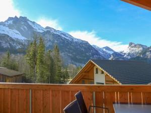 a balcony with a view of a mountain at Apartment Momento by Interhome in Kandersteg