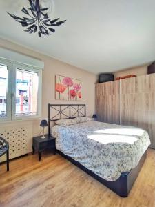 Postel nebo postele na pokoji v ubytování Una Ventana al Naranco