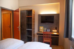 Łóżko lub łóżka w pokoju w obiekcie JUFA Hotel Mariazell